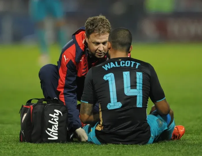 Framed Print : Arsenal's Theo Walcott Receives Treatment During Sheffield Wednesday vs Arsenal - Capital One Cup 2015-16