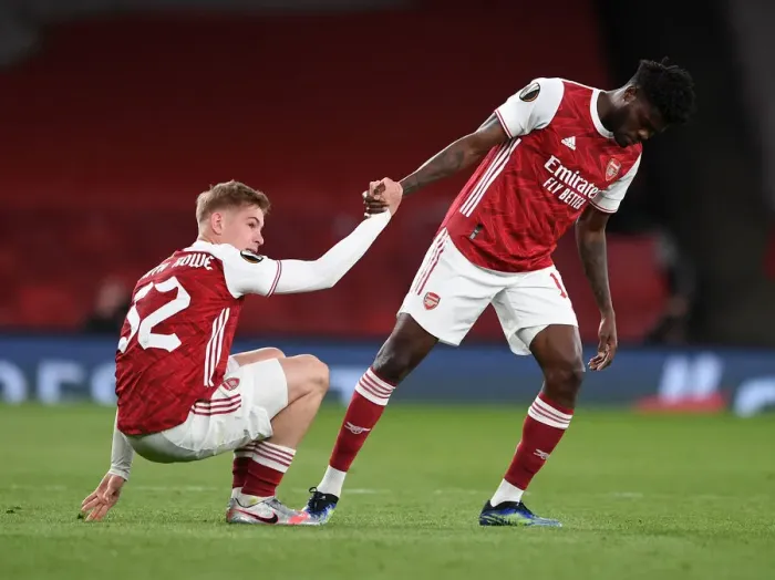 Framed Print : Arsenal's Thomas Partey Consoles Emile Smith Rowe after Europa League Semi-Final Match vs Villarreal Framed Print : Arsenal's Thomas Partey Consoles Emile Smith Rowe after Europa League Semi-Final Match vs Villarreal