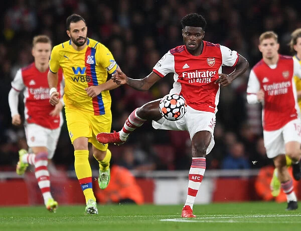 Arsenal's Thomas Partey Fends Off Palace's Milivojevic During Premier League Clash