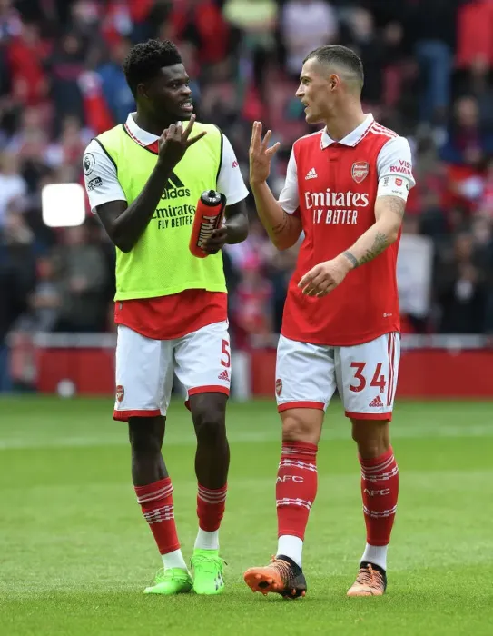 Framed Print : Arsenal's Thomas Partey and Granit Xhaka Share a Moment After Arsenal v Tottenham Rivalry Framed Print : Arsenal's Thomas Partey and Granit Xhaka Share a Moment After Arsenal v Tottenham Rivalry