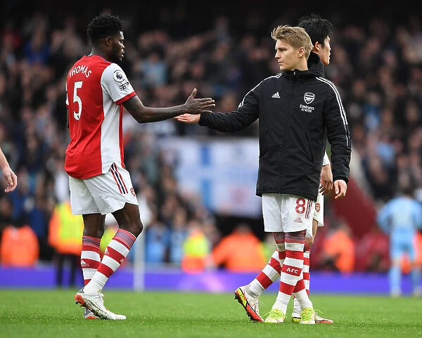 Arsenal's Thomas Partey and Martin Odegaard Celebrate after Beating Manchester City (Arsenal v Manchester City 2021-22)