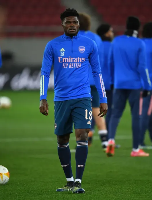 Framed Print : Arsenal's Thomas Partey Prepares for Olympiacos Clash in Empty Europa League Stadium