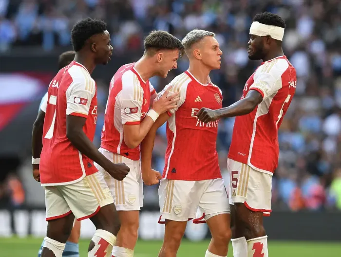 Framed Print : Arsenal's Thrilling Community Shield Victory: Trossard, Saka, Tierney, and Partey Celebrate