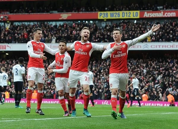Arsenal's Thrilling Goal: Xhaka, Sanchez, Mustafi, and Koscielny Celebrate against Tottenham (2016-17)