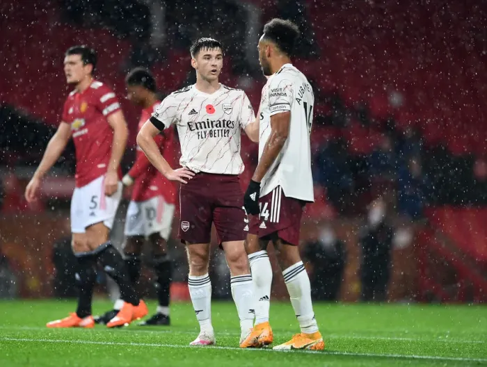 Framed Print : Arsenal's Tierney and Aubameyang Face Off Against Manchester United in Empty Old Trafford (2020-21)