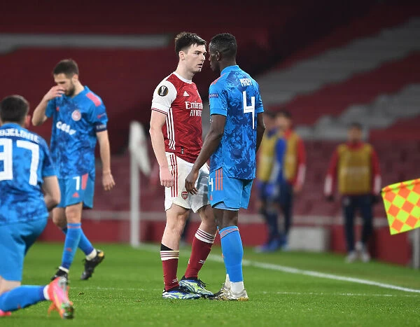 Arsenal's Tierney Goes Head-to-Head with Camara in Empty Europa League Clash, London, 2021