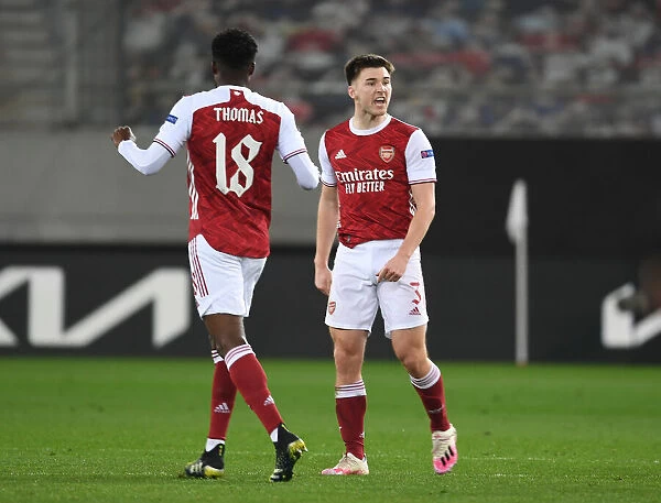 Arsenal's Tierney and Partey: United in Victory - Celebrating Goals in Europa League against SL Benfica