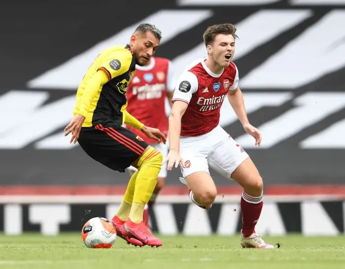 Framed Print : Arsenal's Tierney vs. Pereyra: A Fierce Rivalry Unfolds in the Arsenal vs. Watford Clash