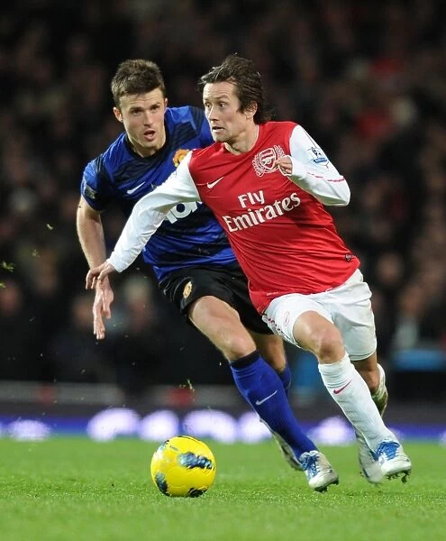 Arsenal's Tomas Rosicky Outmaneuvers Manchester United's Michael Carrick