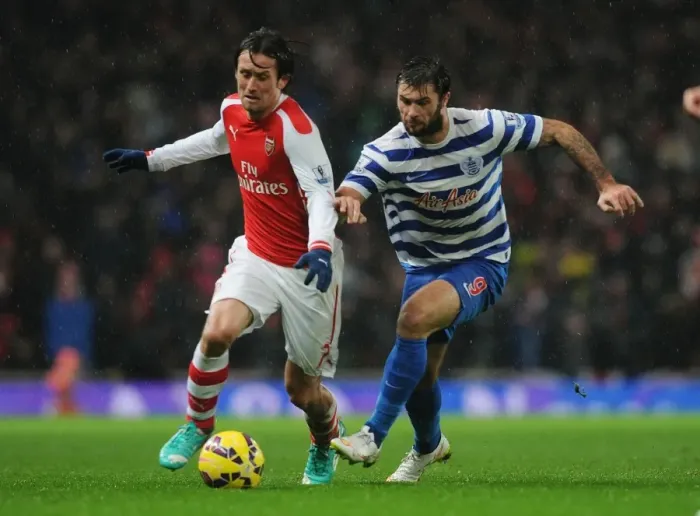 Framed Print : Arsenal's Tomas Rosicky Outmaneuvers QPR's Charlie Austin during the 2014-15 Premier League Match Framed Print : Arsenal's Tomas Rosicky Outmaneuvers QPR's Charlie Austin during the 2014-15 Premier League Match