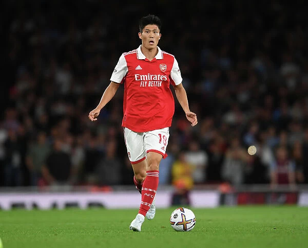 Arsenal's Tomiyasu in Action against Aston Villa in 2022-23 Premier League