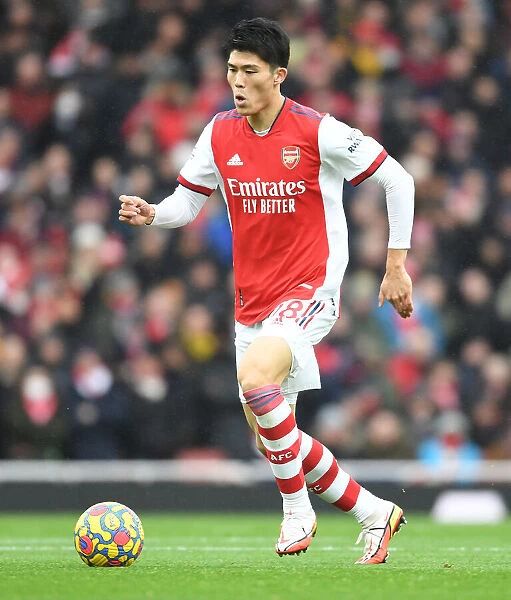 Arsenal's Tomiyasu in Action: Premier League Clash Against Newcastle United, 2021-22