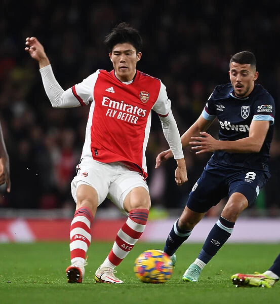 Arsenal's Tomiyasu in Action: Premier League Clash Against West Ham United, 2021-22