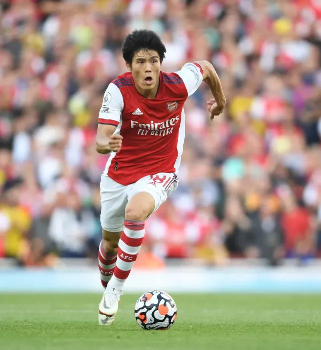 Framed Print : Arsenal's Tomiyasu in Action: Premier League Clash Against Tottenham at Emirates Stadium