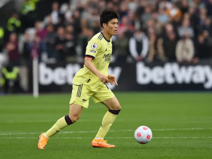 Framed Print : Arsenal's Tomiyasu in Action against West Ham in Premier League Showdown