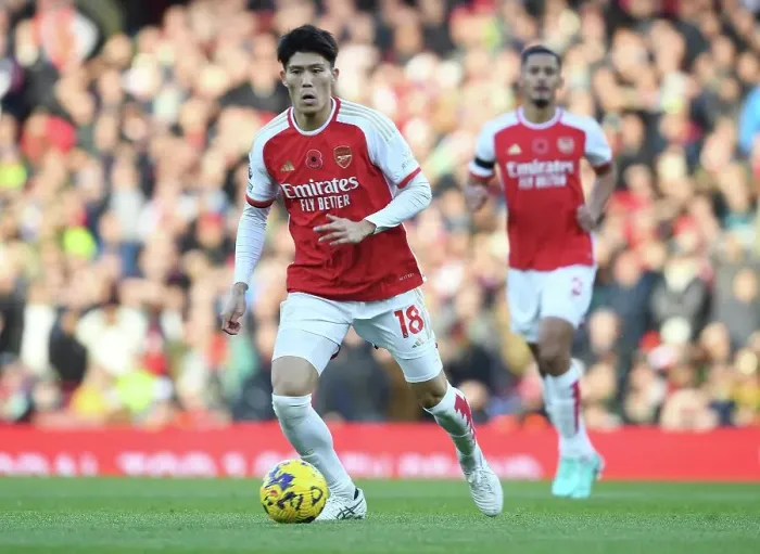 Framed Print : Arsenal's Tomiyasu Charges Forward Against Burnley in Premier League Showdown (2023-24)