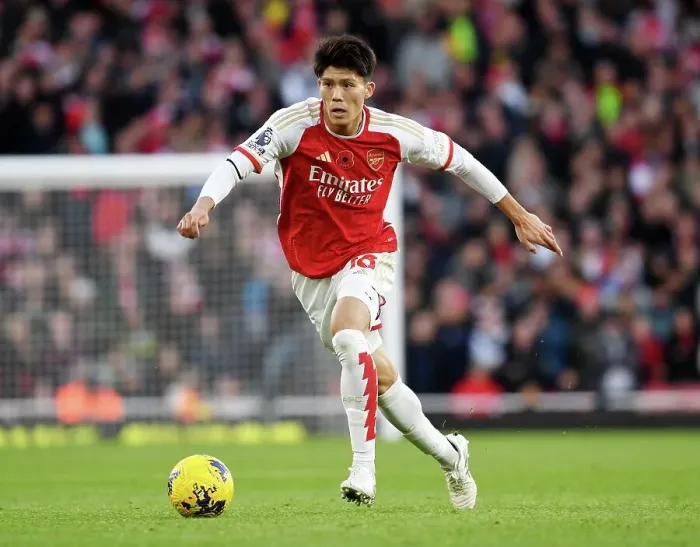 Framed Print : Arsenal's Tomiyasu Charges Forward in Premier League Battle Against Burnley (2023-24) Framed Print : Arsenal's Tomiyasu Charges Forward in Premier League Battle Against Burnley (2023-24)