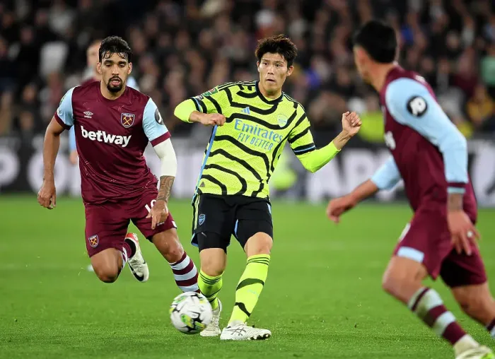 Framed Print : Arsenal's Tomiyasu in Control: West Ham vs Arsenal, Carabao Cup 2023-24