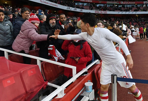 Arsenal's Tomiyasu Delights Fan with Shirt Present after Newcastle Victory