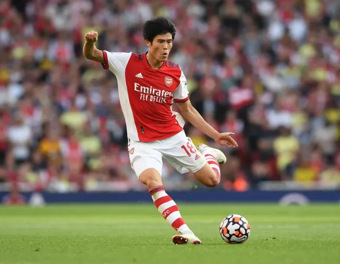 Framed Print : Arsenal's Tomiyasu Faces Off Against Tottenham in Premier League Clash