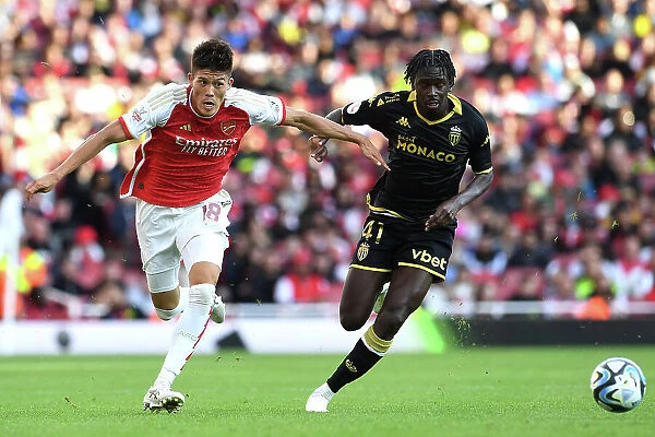 Arsenal's Tomiyasu Fends Off Monaco's Magassa in Emirates Cup Clash