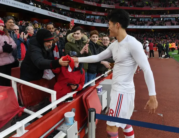 Framed Print : Arsenal's Tomiyasu Gifts Shirt to Ecstatic Fan After Newcastle Victory Framed Print : Arsenal's Tomiyasu Gifts Shirt to Ecstatic Fan After Newcastle Victory