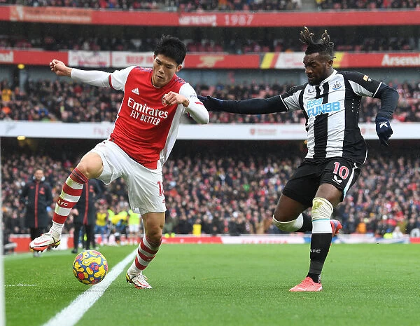 Arsenal's Tomiyasu Outmaneuvers Newcastle's Saint-Maximin in Premier League Clash