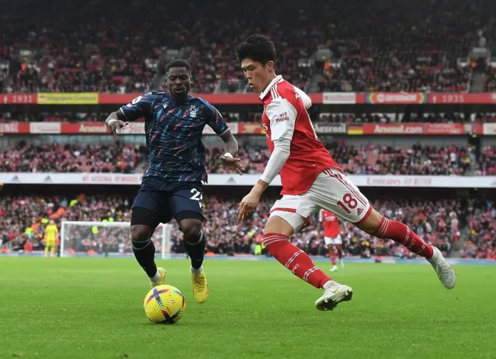 Framed Print : Arsenal's Tomiyasu Outruns Aurier in Premier League Clash vs. Nottingham Forest Framed Print : Arsenal's Tomiyasu Outruns Aurier in Premier League Clash vs. Nottingham Forest