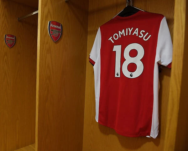 Arsenal's Tomiyasu Readies for Arsenal vs. Tottenham: Jersey Hangs in Changing Room