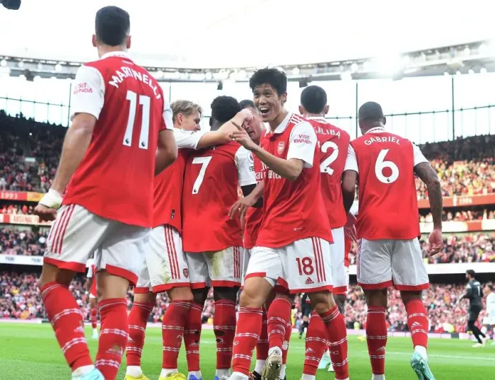 Framed Print : Arsenal's Tomiyasu and Saka: Unstoppable Duo Strikes Twice Against Liverpool in the 2022-23 Premier League