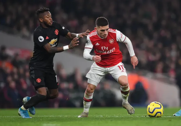 Framed Print : Arsenal's Torreira Clashes with Manchester United's Fred in Premier League Showdown Framed Print : Arsenal's Torreira Clashes with Manchester United's Fred in Premier League Showdown