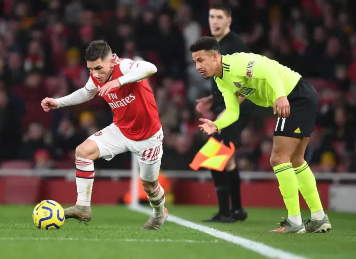 Framed Print : Arsenal's Torreira Clashes with Sheffield United's Robinson in Premier League Showdown Framed Print : Arsenal's Torreira Clashes with Sheffield United's Robinson in Premier League Showdown