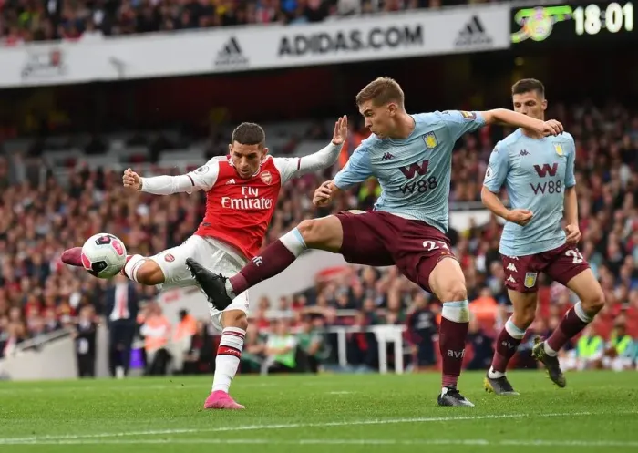 Framed Print : Arsenal's Torreira Faces Off Against Villa's Engels in Intense Premier League Clash Framed Print : Arsenal's Torreira Faces Off Against Villa's Engels in Intense Premier League Clash