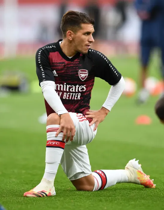 Framed Print : Arsenal's Torreira Warms Up for Empty Arsenal v Liverpool Clash (2019-20)