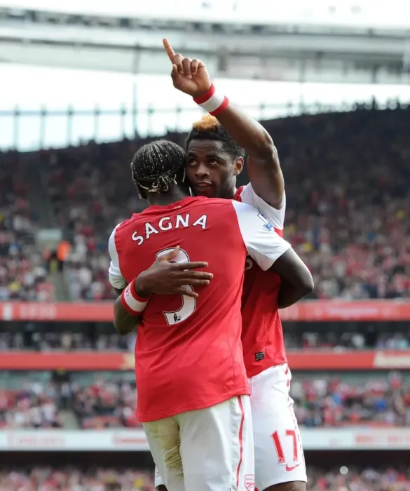 Framed Print : Arsenal's Triumph: Alex Song and Bacary Sagna's Celebration after 3-0 Win over Bolton Wanderers in the Premier League