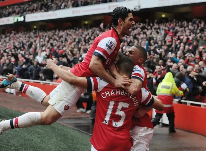 Framed Print : Arsenal's Triumph: Arteta, Oxlade-Chamberlain, and Gibbs Celebrate Second Goal vs Norwich City (2013)