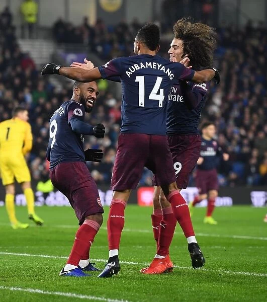 Arsenal's Triumph: Aubameyang, Lacazette, and Guebdouzi Celebrate Goal Against Brighton (December 2018)