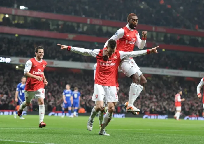 Framed Print : Arsenal's Triumph: Koscielny, Djourou, and Fabregas Celebrate Second Goal in Carling Cup Semi-Final Victory Against Ipswich Town (3:0, 3:1 agg)