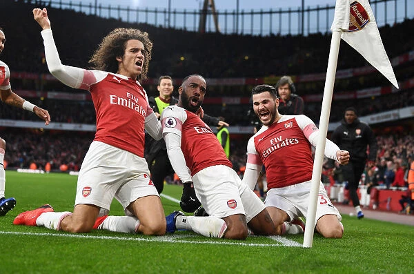 Arsenal's Triumph: Lacazette, Guendouzi, and Kolasinac Celebrate Goals Against Tottenham