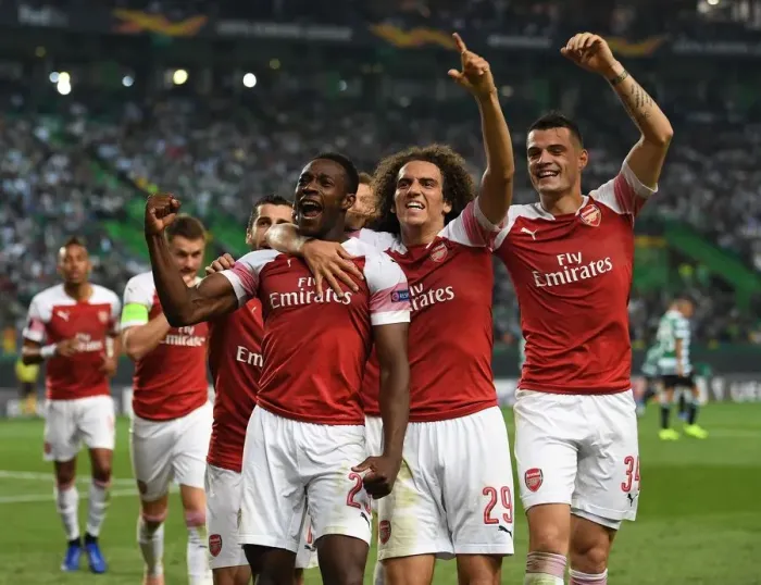 Framed Print : Arsenal's Triumph in Lisbon: Welbeck, Guendouzi, and Xhaka's Goal Celebration (Sporting vs Arsenal, 2018-19)