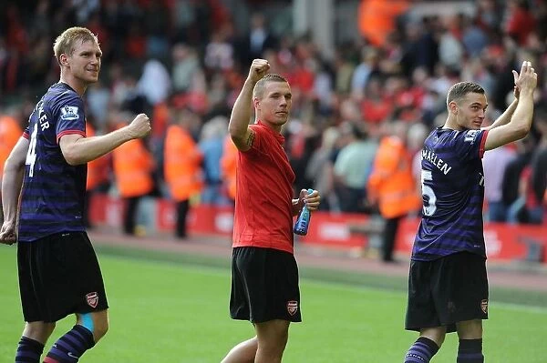 Arsenal's Triumph: Mertesacker, Podolski, and Vermaelen's Victory Dance (Liverpool 2012)