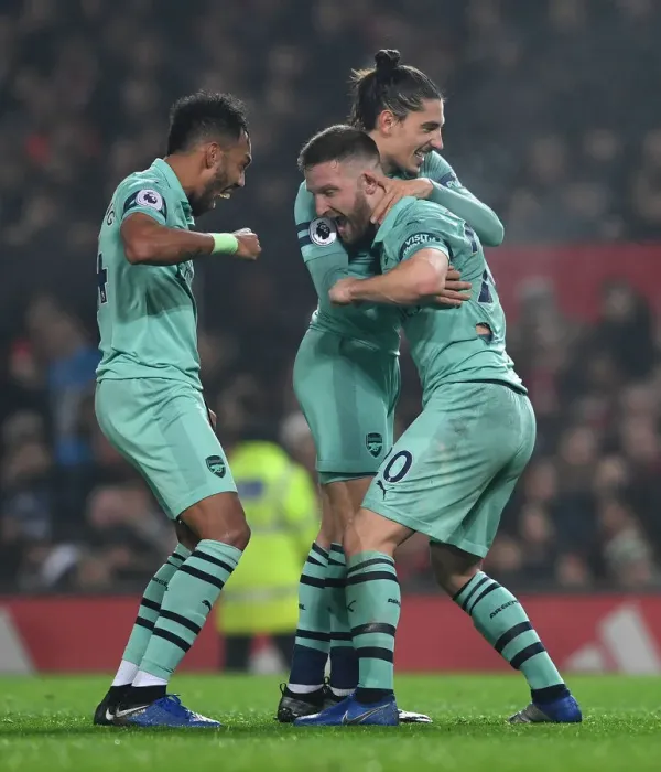 Framed Print : Arsenal's Triumph: Mustafi, Aubameyang, and Bellerin Celebrate First Goal Against Manchester United (2018-19)