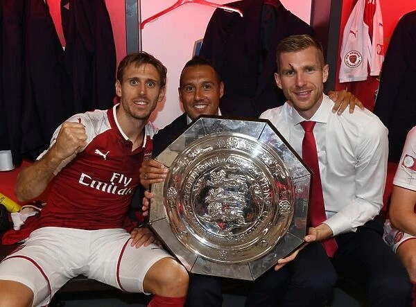 Arsenal's Triumph: Nacho Monreal, Santi Cazorla, and Per Mertesacker with the FA Community Shield