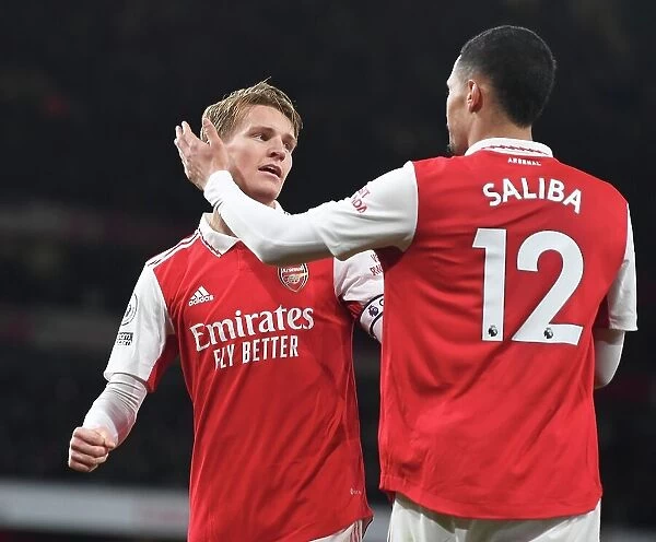 Arsenal's Triumph: Odegaard and Saliba Celebrate Third Goal vs. Everton (2022-23)