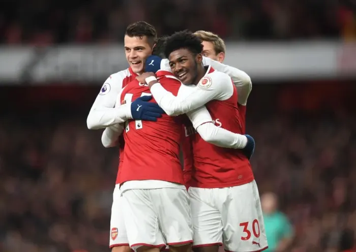 Framed Print : Arsenal's Triumph: Ozil, Xhaka, Maitland-Niles in Unison - Goal Celebration (2017-18)