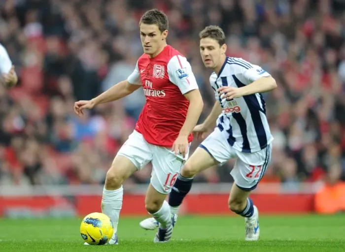 Framed Print : Arsenal's Triumph: Ramsey's Brilliance Leads to 3-0 Victory over West Bromwich Albion in the Premier League Framed Print : Arsenal's Triumph: Ramsey's Brilliance Leads to 3-0 Victory over West Bromwich Albion in the Premier League