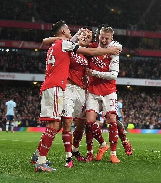 Arsenal's Triumph: Trossard, Xhaka, and Zinchenko Celebrate Goal Against Brentford