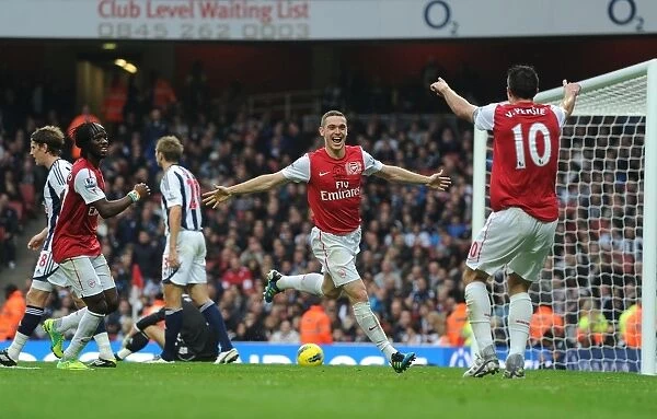Arsenal's Triumph: Vermaelen, Van Persie, and Gervinho Celebrate Goals Against West Bromwich Albion (2011-12)