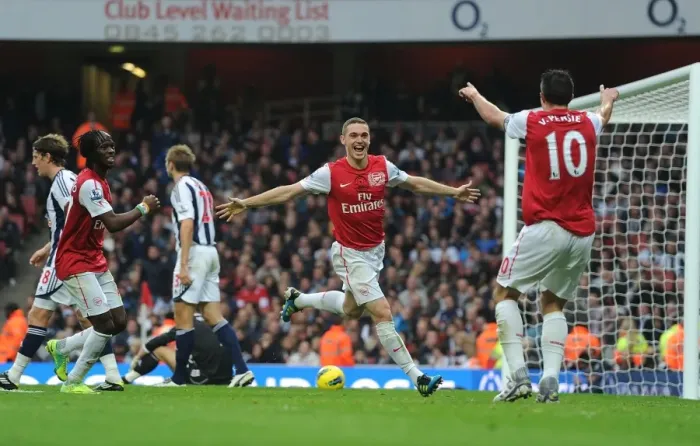 Framed Print : Arsenal's Triumph: Vermaelen, Van Persie, and Gervinho Celebrate Goals Against West Bromwich Albion (2011-12) Framed Print : Arsenal's Triumph: Vermaelen, Van Persie, and Gervinho Celebrate Goals Against West Bromwich Albion (2011-12)