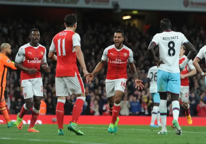 Framed Print : Arsenal's Triumph: Walcott, Welbeck, Ozil Celebrate Goals Against West Ham Framed Print : Arsenal's Triumph: Walcott, Welbeck, Ozil Celebrate Goals Against West Ham